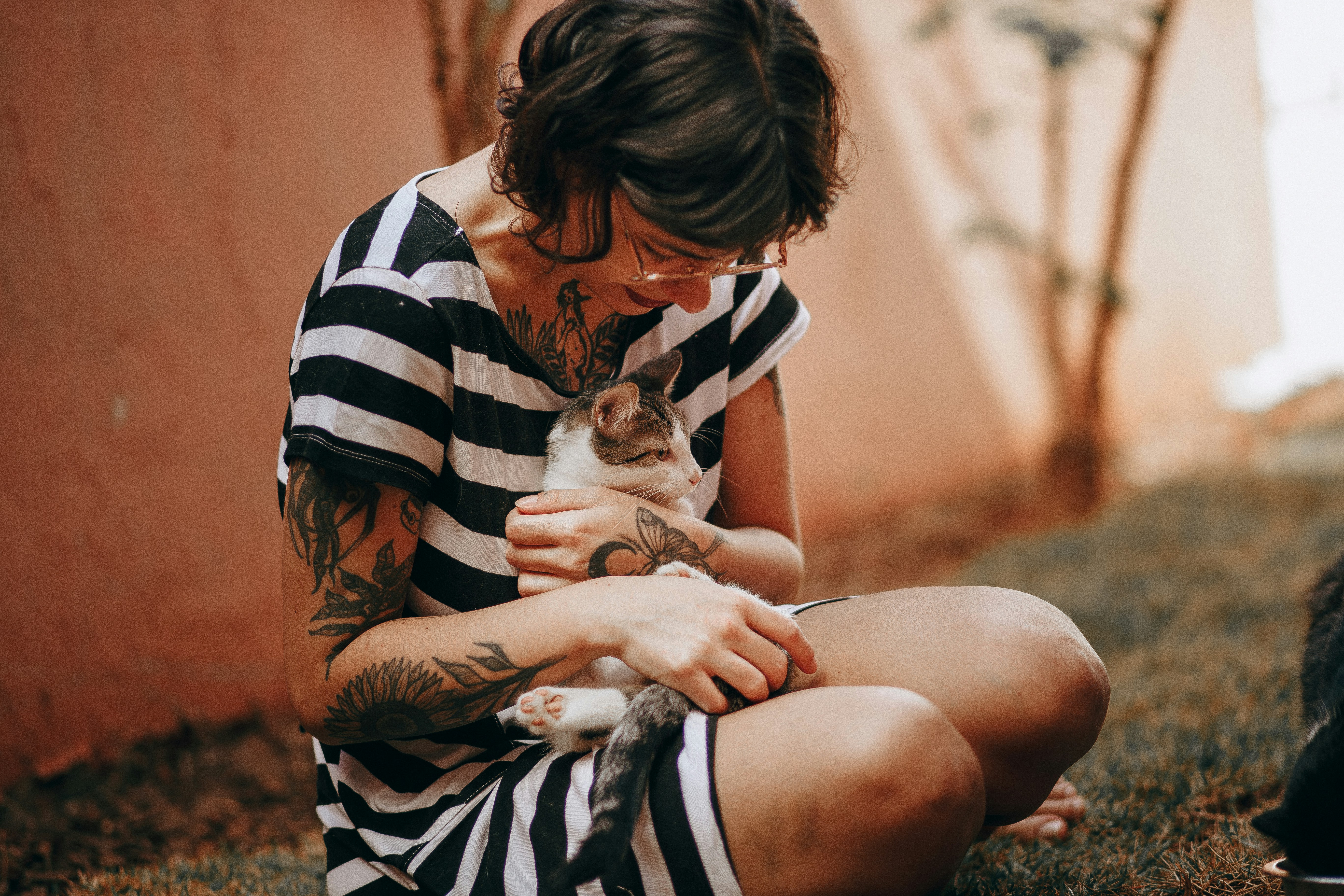 Woman holding a cat close